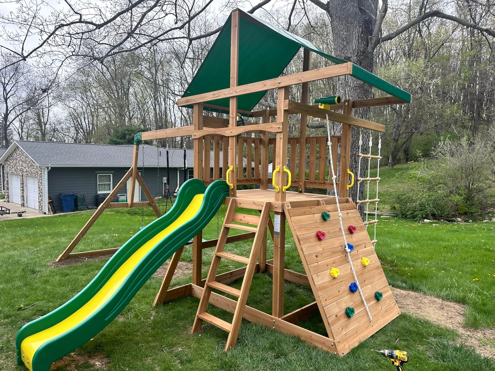Backyard Discovery Mount Mckinley Cedar Wood Swing Set with Wave Slide, Play Deck, Double Rock Wall, Rope Ladder, Web Swing, Belt Swings, Toy Telescope, Steering Wheel, Sandbox Area, Outdoor Playset customer photo 2