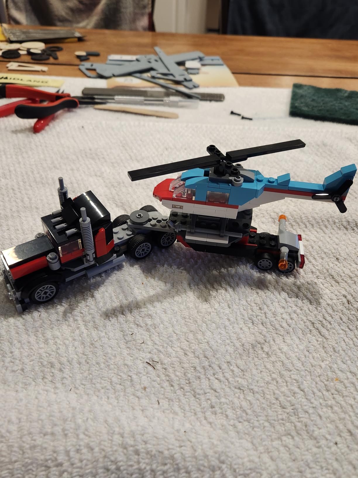 Creator 3 in 1 Flatbed Truck with Helicopter Toy, Transforms from Flatbed Truck Toy to Propeller Plane to Hot Rod and SUV Cars, Gift Idea for Boys and Girls Ages 7 Years Old and Up, 31146 customer photo 1